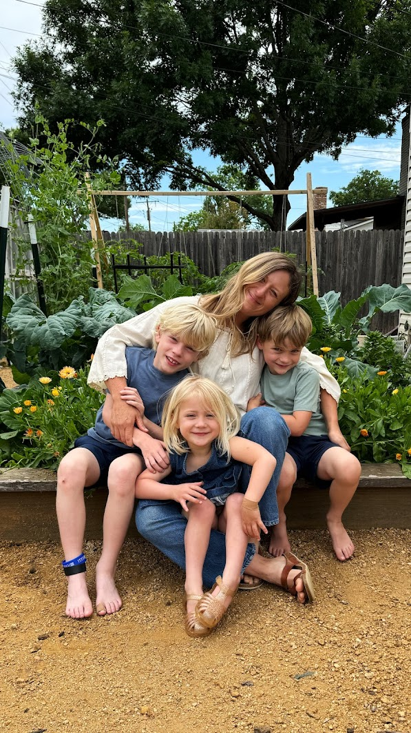 Kenley with her three children in their family garden