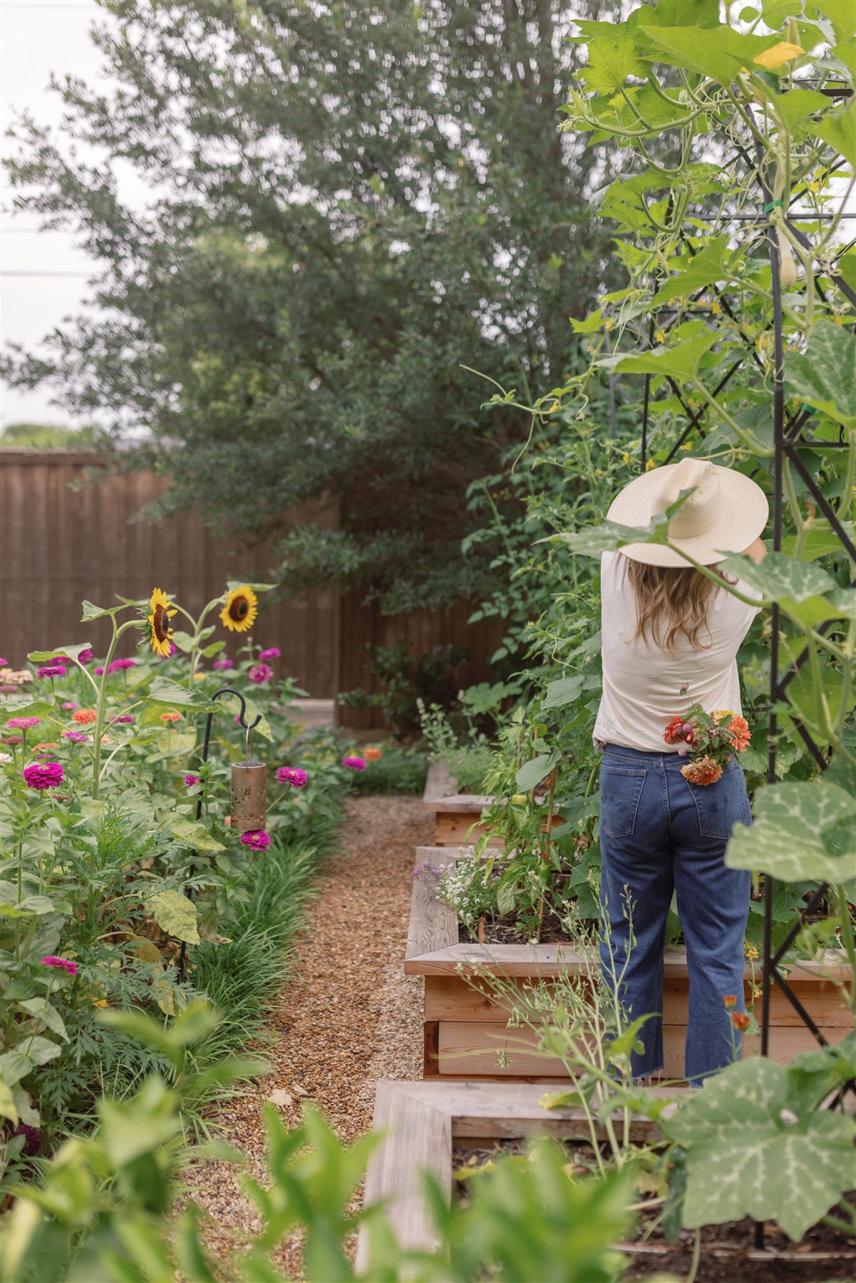 Founder tending a wild trellis kitchen garden